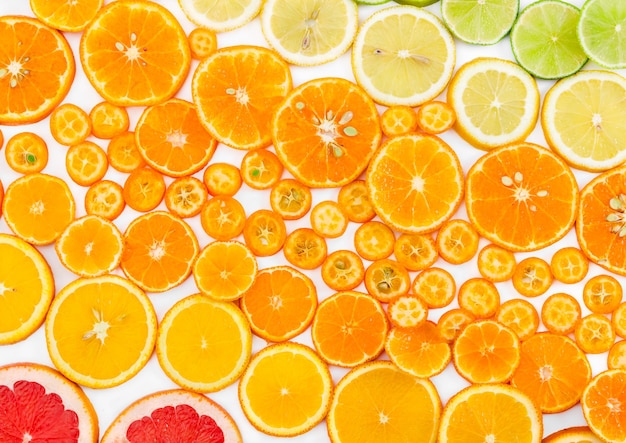 Fruit citrus background with grapefruit orange tangerine lemon lime and kumquat Top view