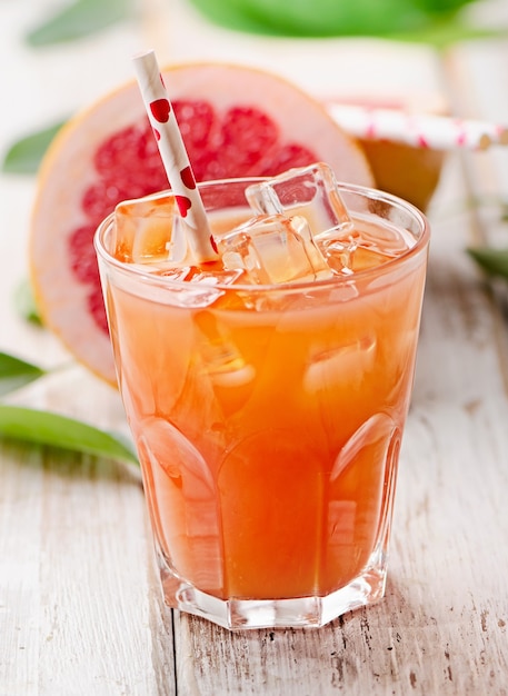 Fruit cocktail with strawberry on wooden table