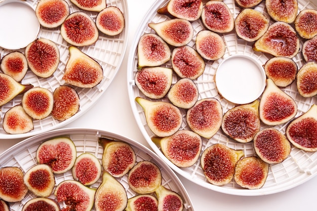 Fruit drying process on dehydrator white plates