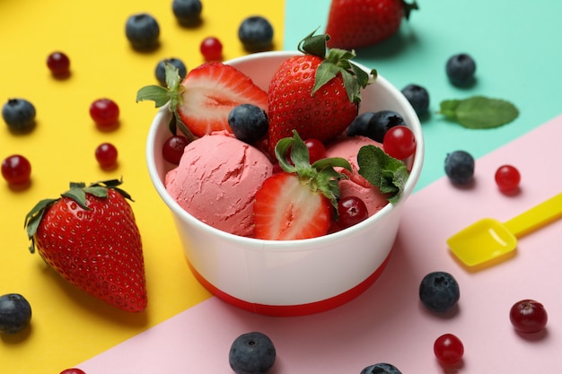 Fruit ice cream and ingredients on color