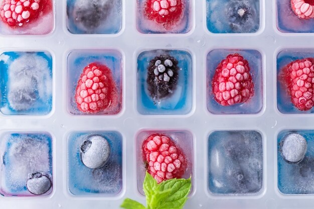 Photo fruit ice cubes with organic berries.