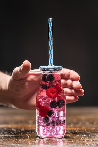 Fruit infuser water bottle with straw and fruits