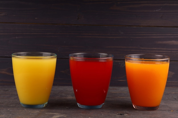 Fruit juices in a glass of different colors