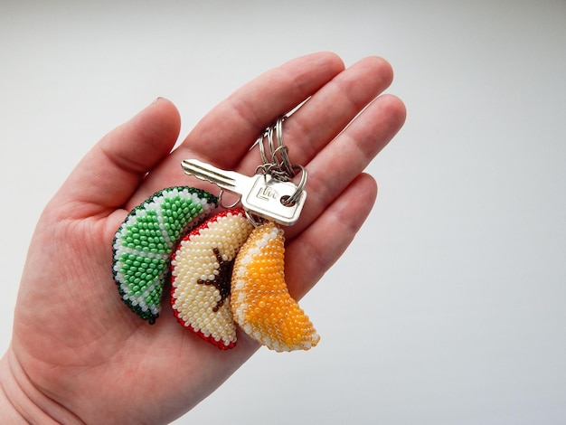 Fruit keychains in a female hand