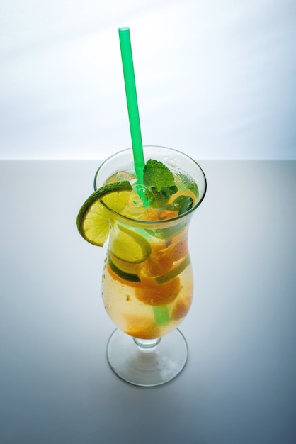 Fruit lemonade in hurricane with orange mint and lime