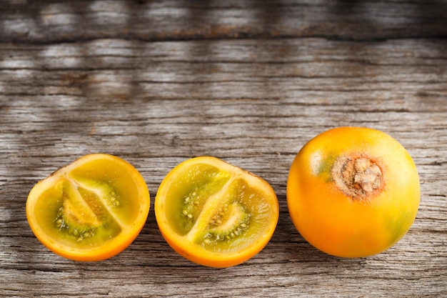 Fruit of lulo or naranjilla on wood