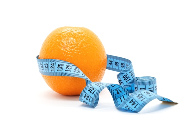 Fruit orange is wrapped with blue measuring tape on white background