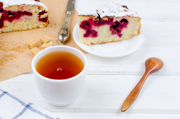 Fruit pie and tea on a wooden table