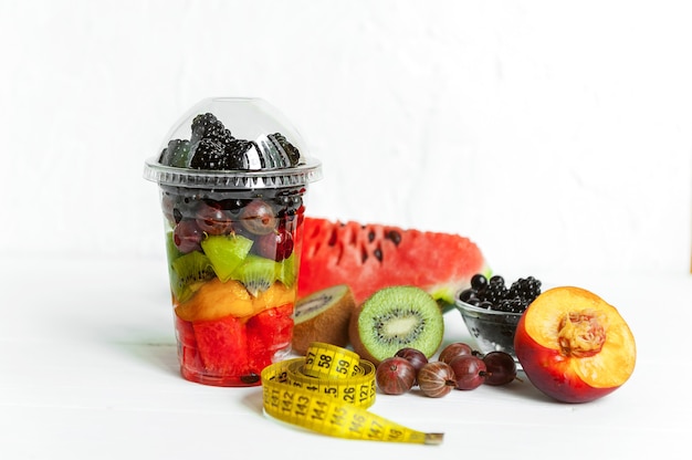 Fruit in a plastic cup.