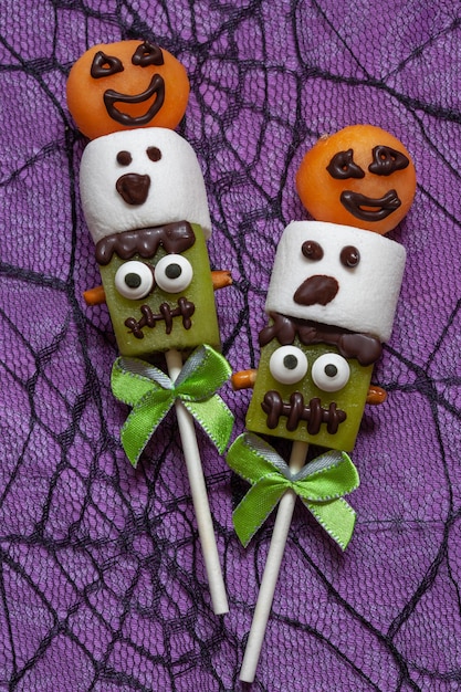 Fruit pops with marshmallow decorated for halloween