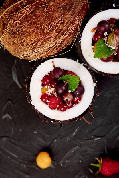 Fruit salad in coconut shell bowl