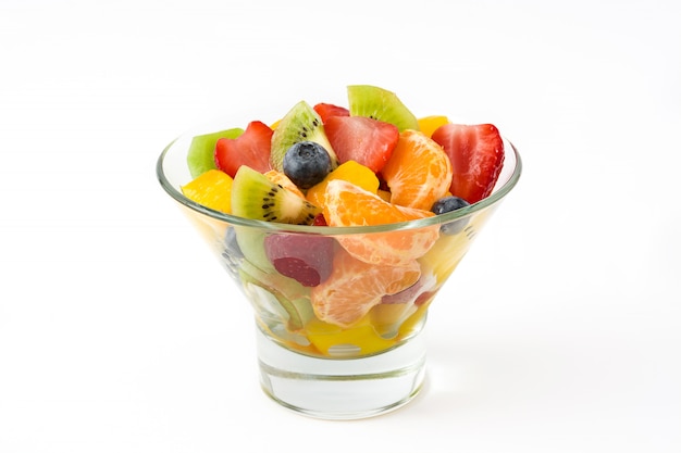 Fruit salad in crystal bowl isolated on white