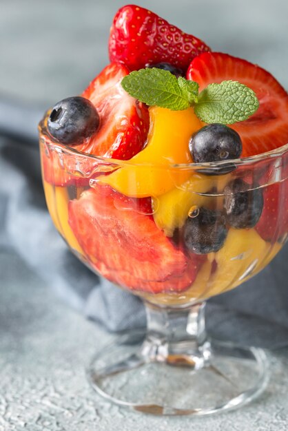 Fruit salad in the glass vase