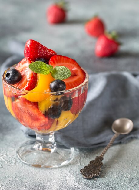 Fruit salad in the glass vase