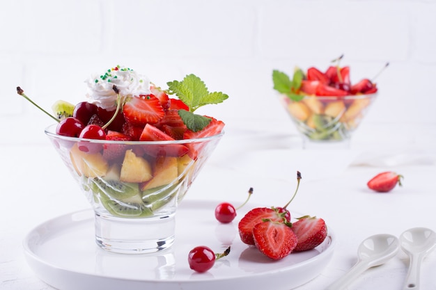 Fruit salad of strawberries, kiwis and apricots. Fresh and tasty  snack