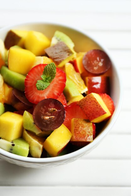 Photo fruit salad on table