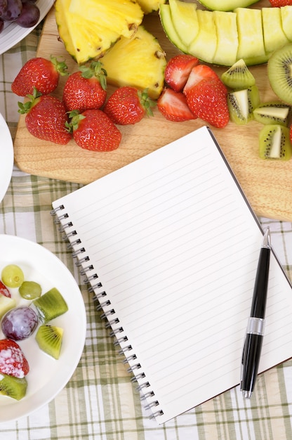 Fruit salad with notebook