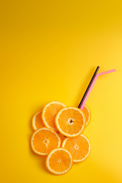 fruit in shape of cocktail on yellow surface