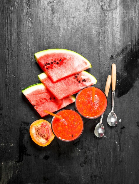 Photo fruit smoothie with watermelon. on black background.