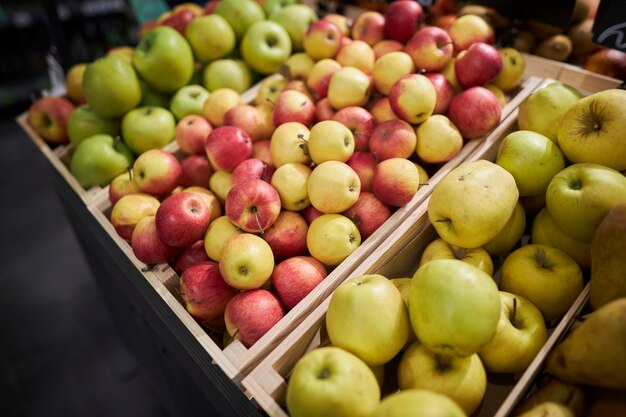 Fruit stand in the supermarket apples on the counter