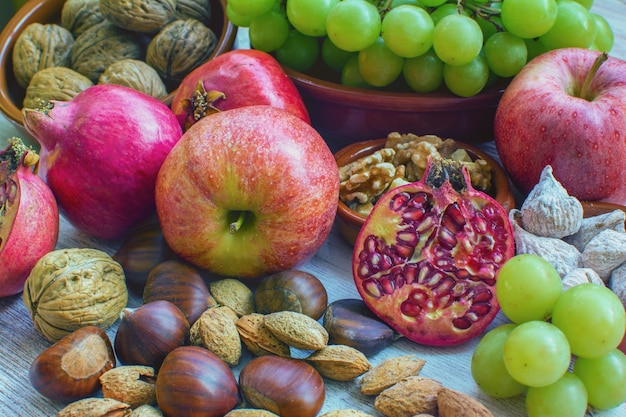 Fruit table Grapes figs blackberries passion fruit pomegranate and delicious dried fruits