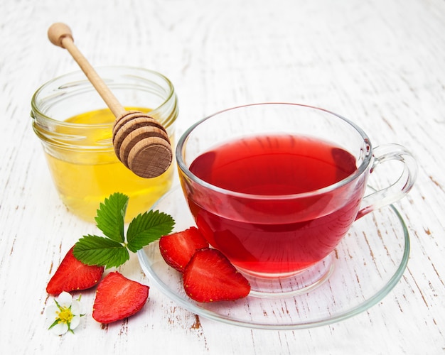 Fruit tea with strawberries and honey