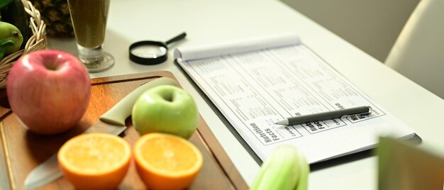 Fruit and vegetable on chopping board with Nutrition Facts on table