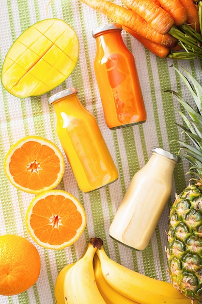 Fruit and vegetable smoothies in glass bottles