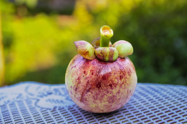 A fruit with the top cut off and the top cut off