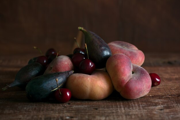 Fruits on the dark wooden table