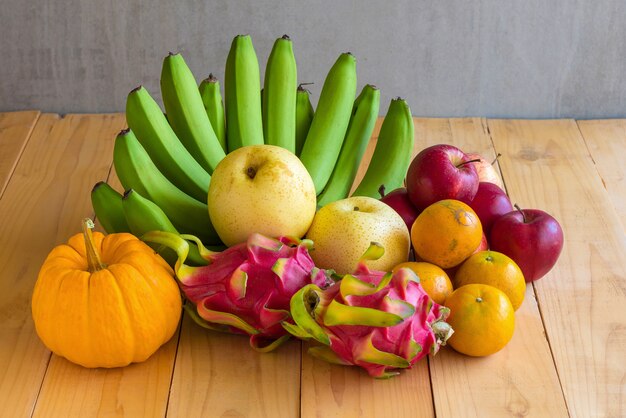 Fruits diet concept. different fruits on wooden table