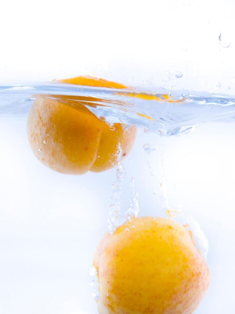 Fruits falling into the water