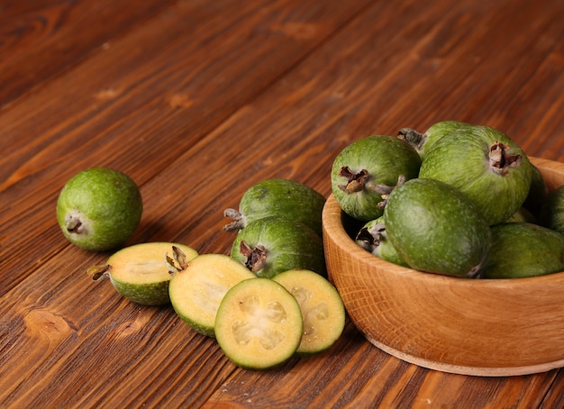 Fruits of feijoa in a wooden bowl on the table