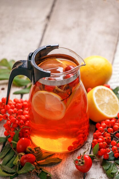 Fruits in glass jar on table