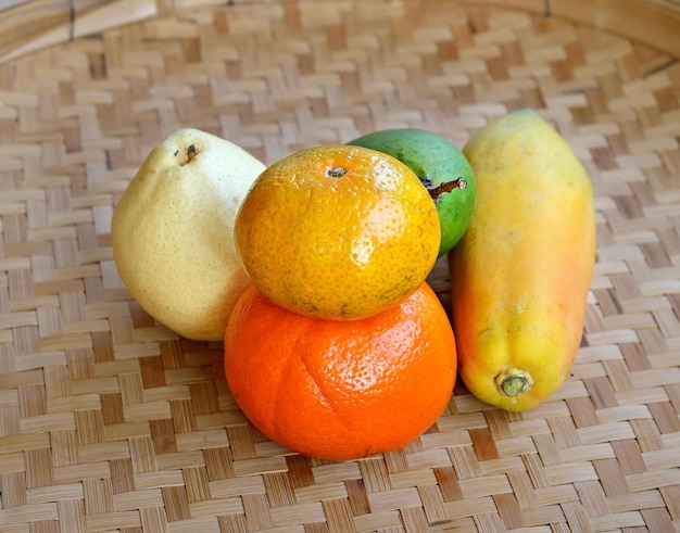 Fruits mango pear papaya and orange