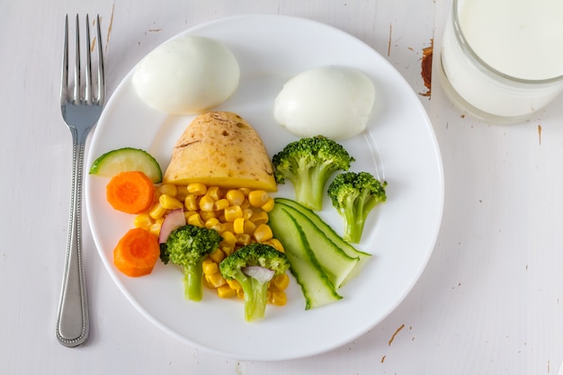 Fruits and vegetables arranged to look appealing to kids in funny face