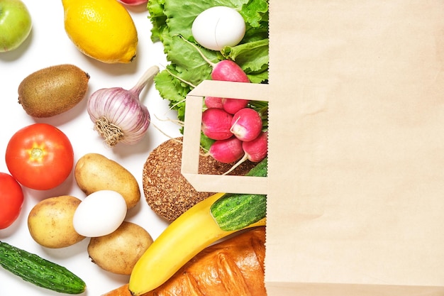 Fruits vegetables and products in a paper grocery bag