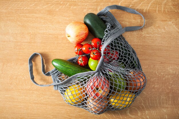 Fruits vegetables in reusable mesh cotton bag, plastic free zero waste concept