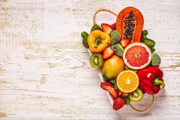 Fruits and vegetables rich in vitamin C in box Healthy eating Top view