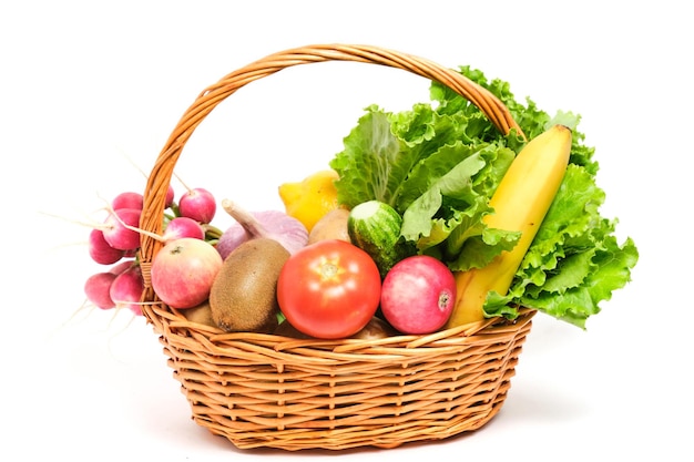 Fruits and vegetables in a wicker basket white background