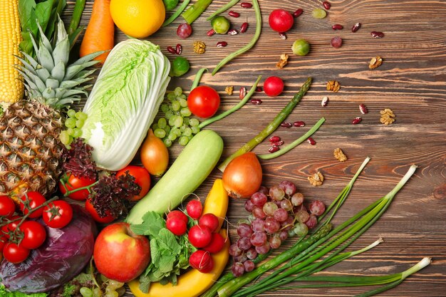 Fruits and vegetables on wooden background