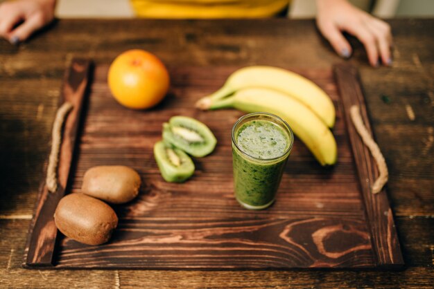 Fruits on wooden tray closeup