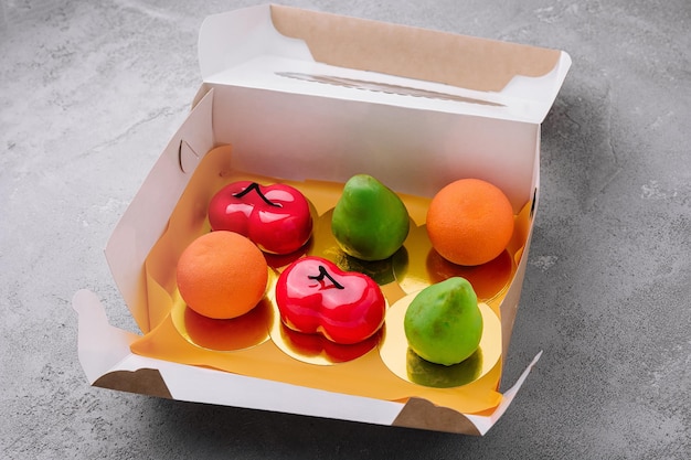 Fruitshaped mousse cakes in a box