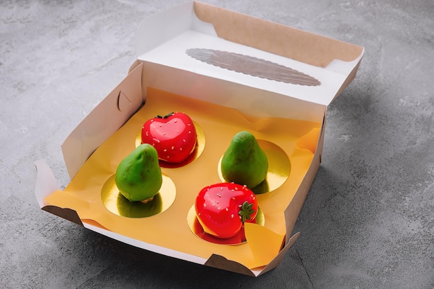 Fruitshaped mousse cakes in a box