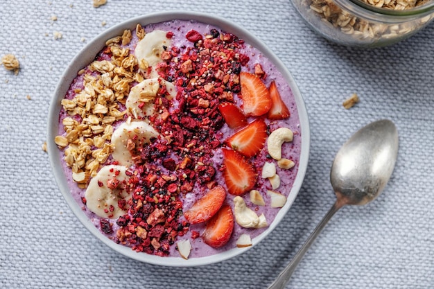 Fruity healthy muesli bowl on table