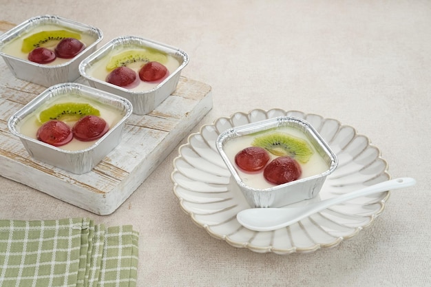 Fruity Milk Pudding, sweet vanilla silk pudding dessert with grape and kiwi fruit topping