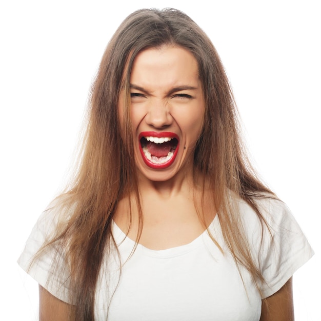 Frustrated and angry woman screaming Studio shot