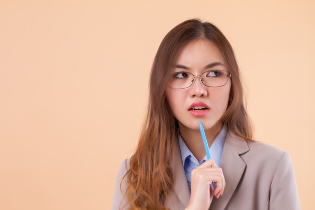 frustrated asian business woman with.a pen