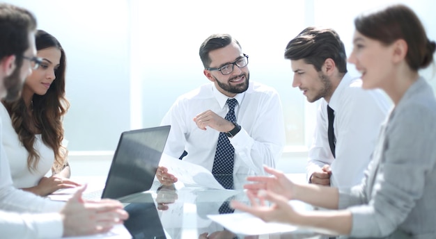 Frustrated business people sitting at the table in officebusiness concept