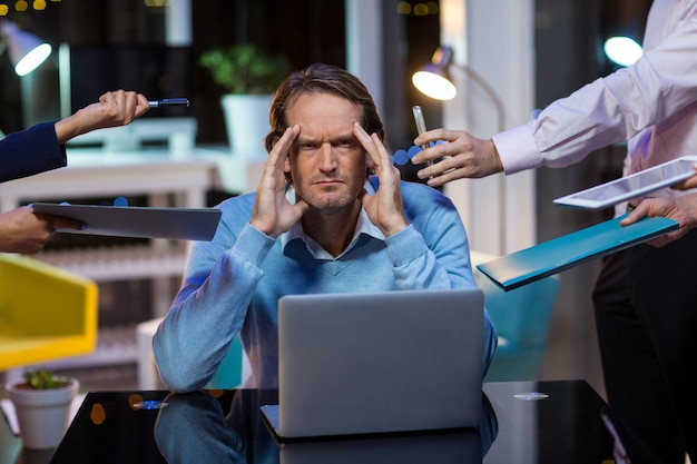 Frustrated businessman sitting in office